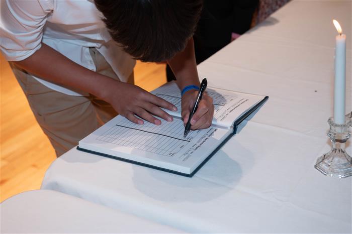 Signing the Memory Book